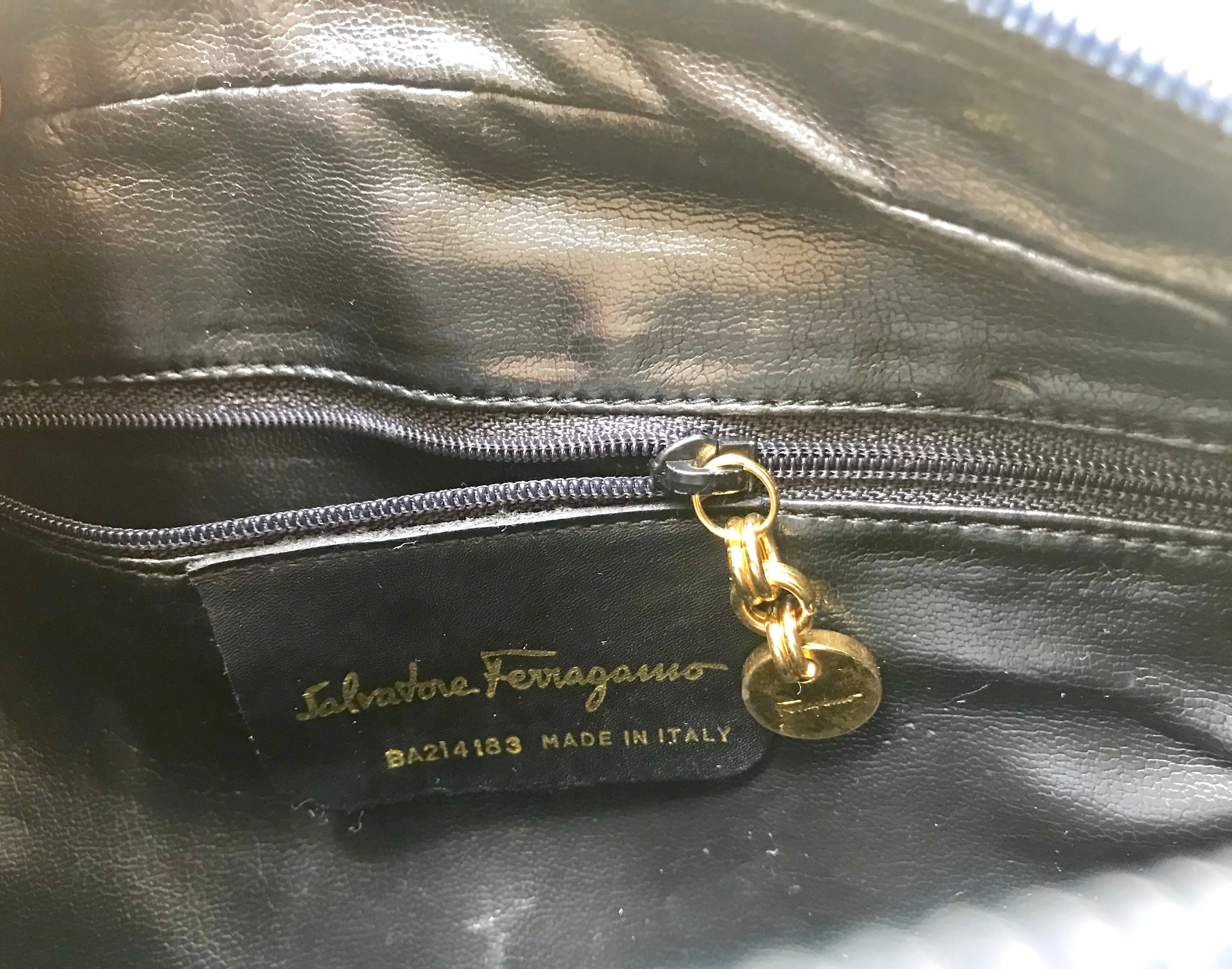 Vintage Salvatore Ferragamo dark navy leather shoulder bag with golden logo embossed motif from vara collection. Classic purse. 050406r7