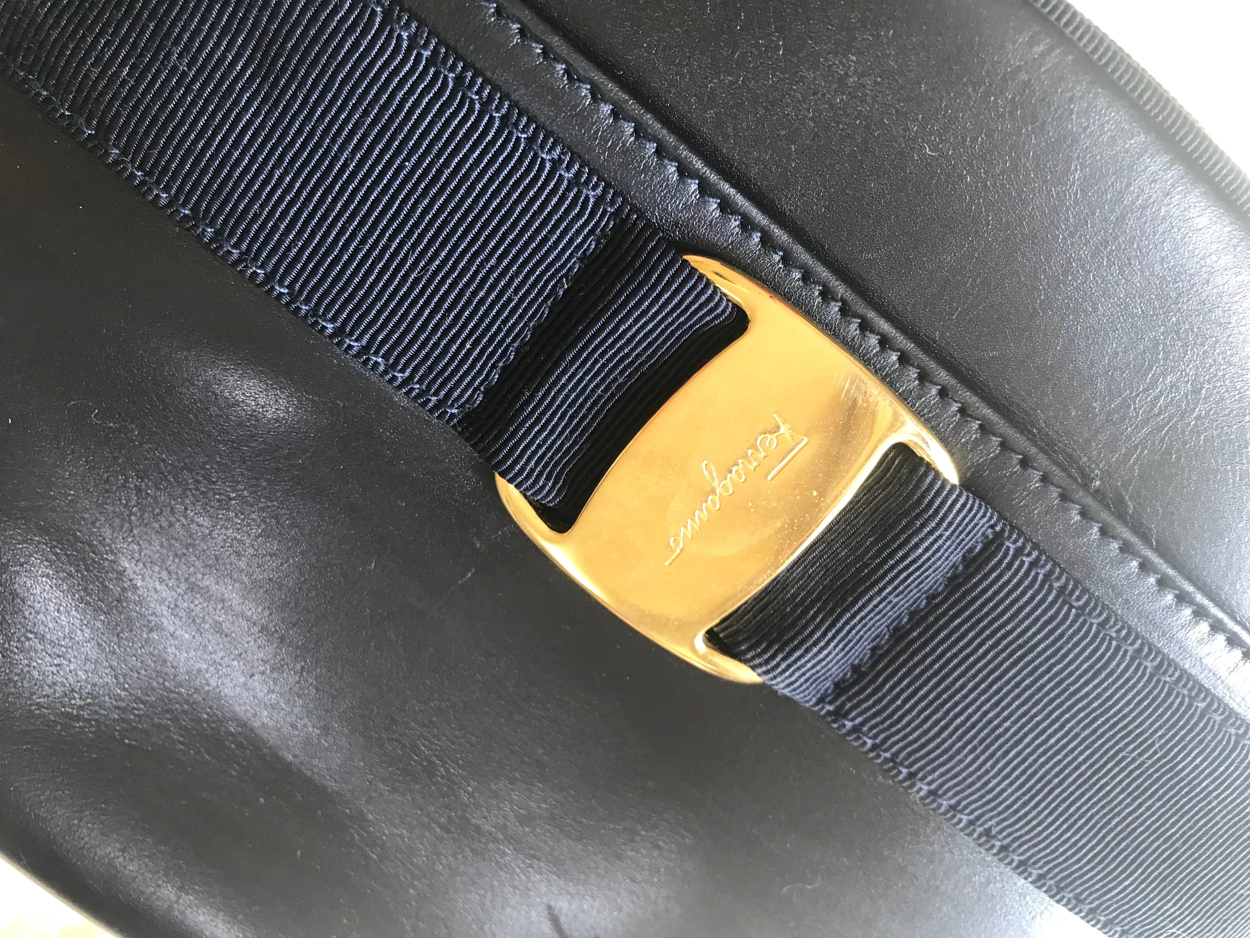 Vintage Salvatore Ferragamo dark navy leather shoulder bag with golden logo embossed motif from vara collection. Classic purse. 050406r7